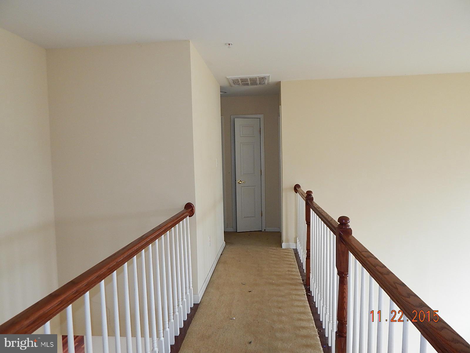 14411 Autumn Rust Road Boyds, MD 20841 - Photo 12 of 30 a view of a hallway with wooden floor
