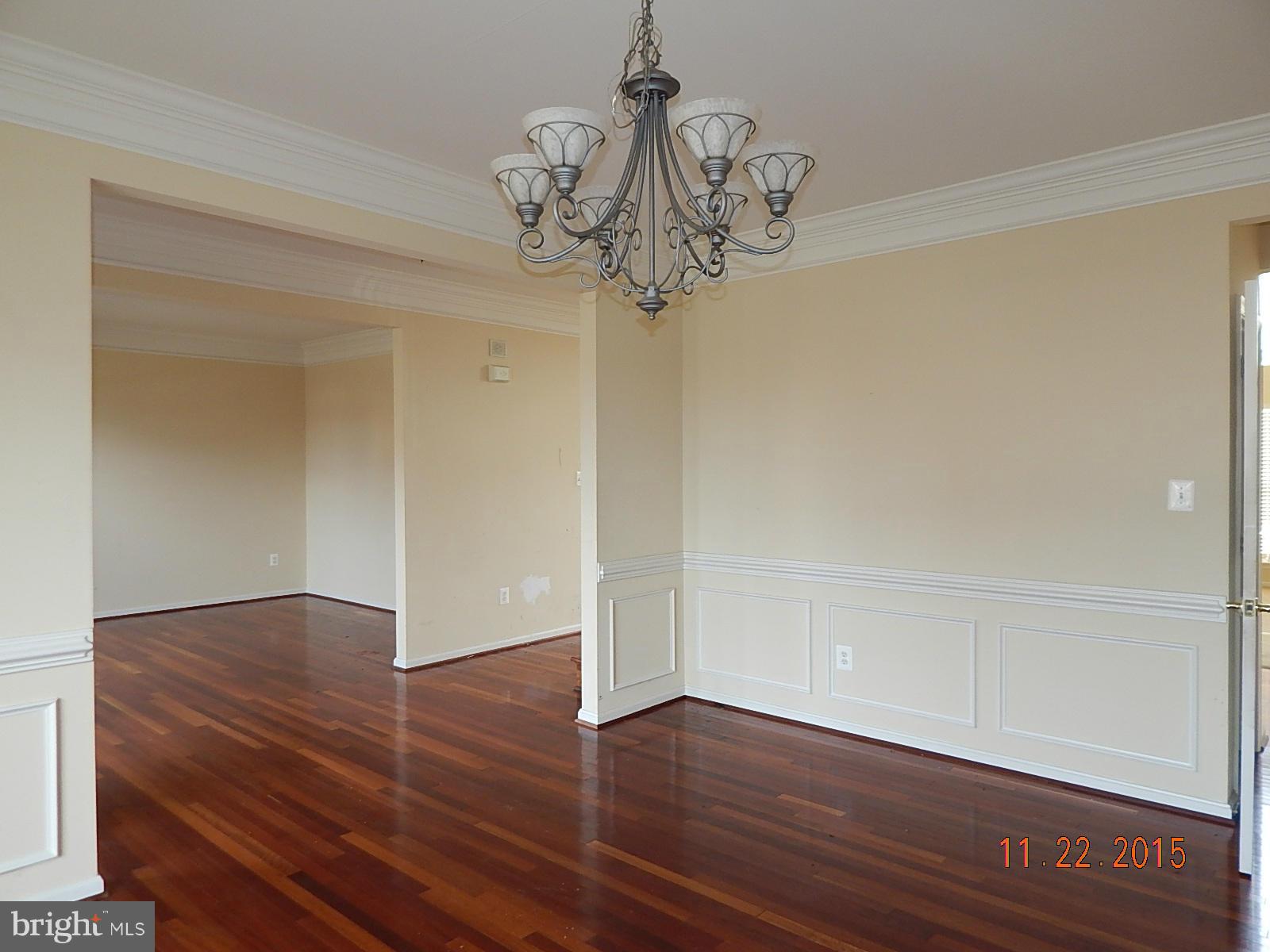 14411 Autumn Rust Road Boyds, MD 20841 - Photo 4 of 30 a view of a hallway with wooden floor