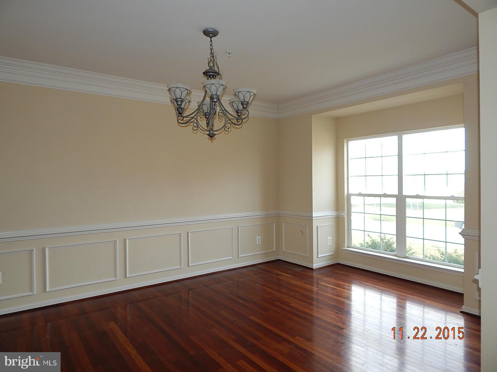 14411 Autumn Rust Road Boyds, MD 20841 - Photo 5 of 30 a view of an empty room with wooden floor and a window