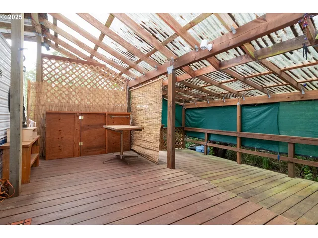 a view of a balcony with wooden floor