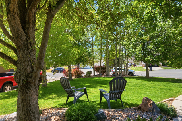 5196 Rodeo Circle Oakley, UT 84055 - Photo 5 of 57 Expansive lawn area featuring mature trees providing ample shade