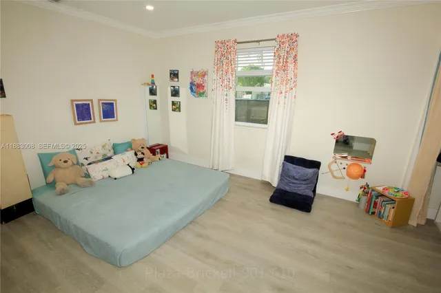 a bed room with a bed and a chair