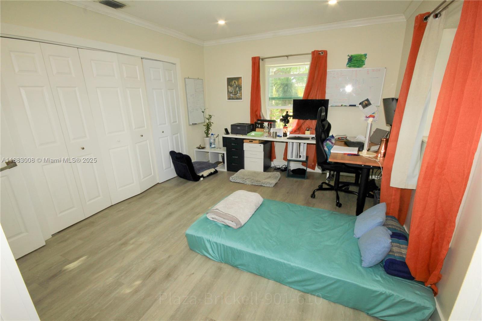 2754 Southwest 36th Avenue Miami, FL 33133 - Photo 21 of 35 This spacious indoor area offers flexibility for various uses, with generous storage options and large windows that connect the interior to the outdoors, enhancing functionality and comfort.