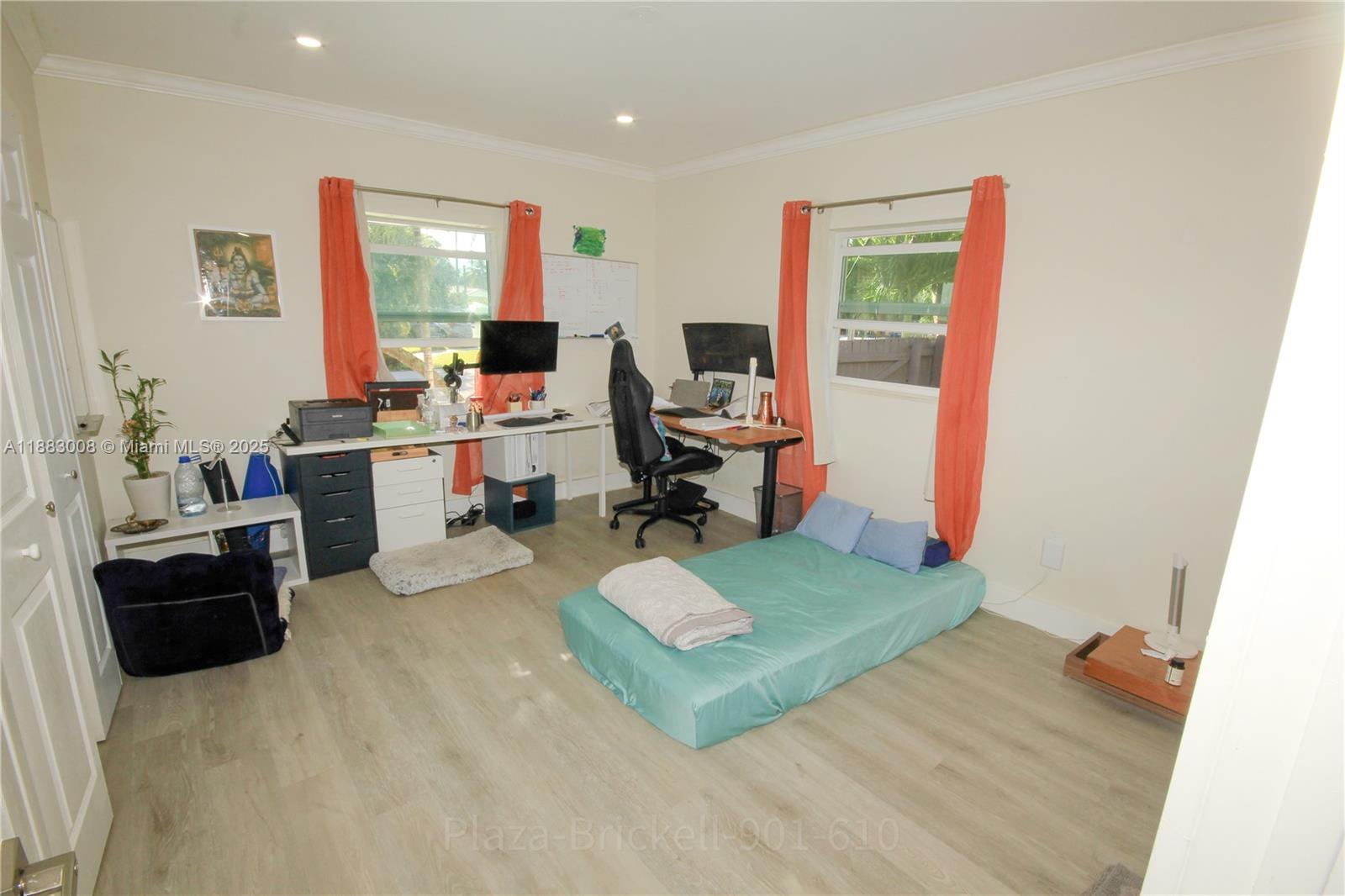 2754 Southwest 36th Avenue Miami, FL 33133 - Photo 22 of 35 This adaptable indoor space is perfect for a home office or guest room, with abundant natural light and a functional layout that accommodates various activities while ensuring easy maintenance.