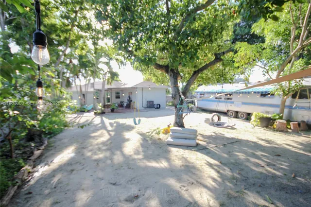 a view of city street with tall trees