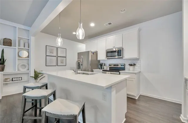 a kitchen with counter space cabinets and appliances
