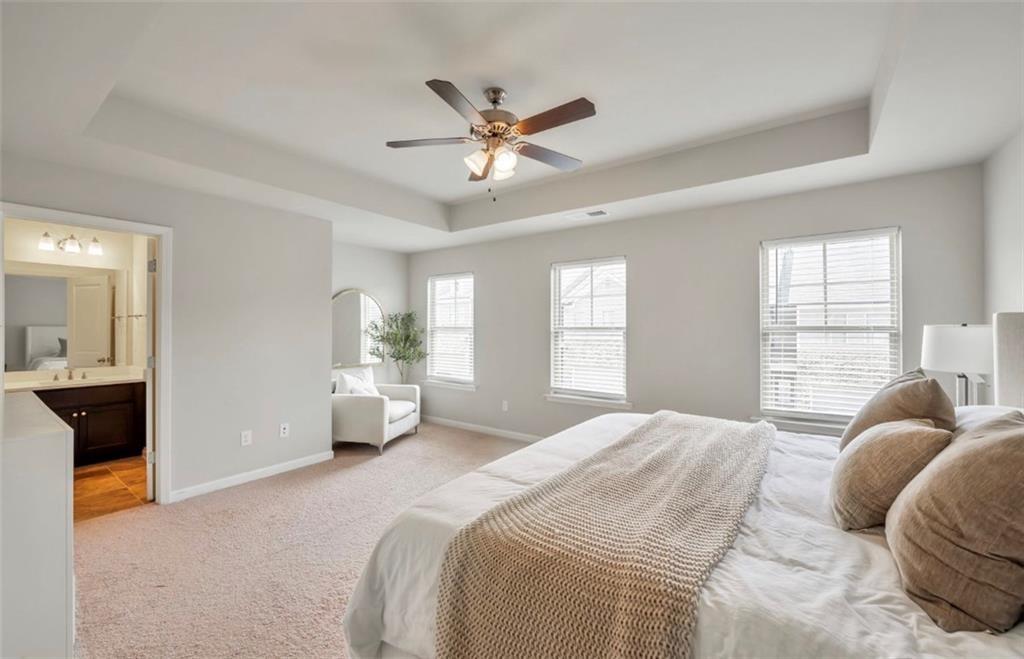 378 Mulberry Row Atlanta, GA 30354 - Photo 5 of 12 a spacious bedroom with a bed and ceiling fan