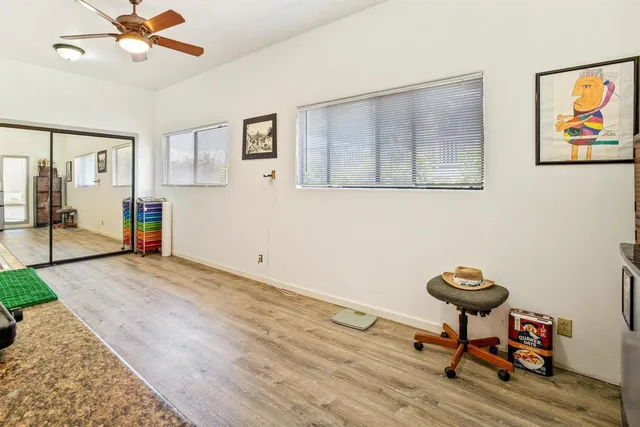 a view of a livingroom with furniture and wooden floor