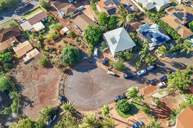 an aerial view of residential building and lake