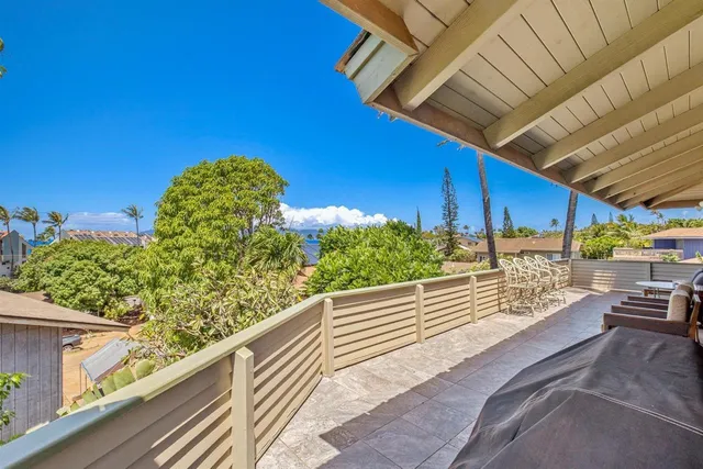 a view of a balcony with chairs