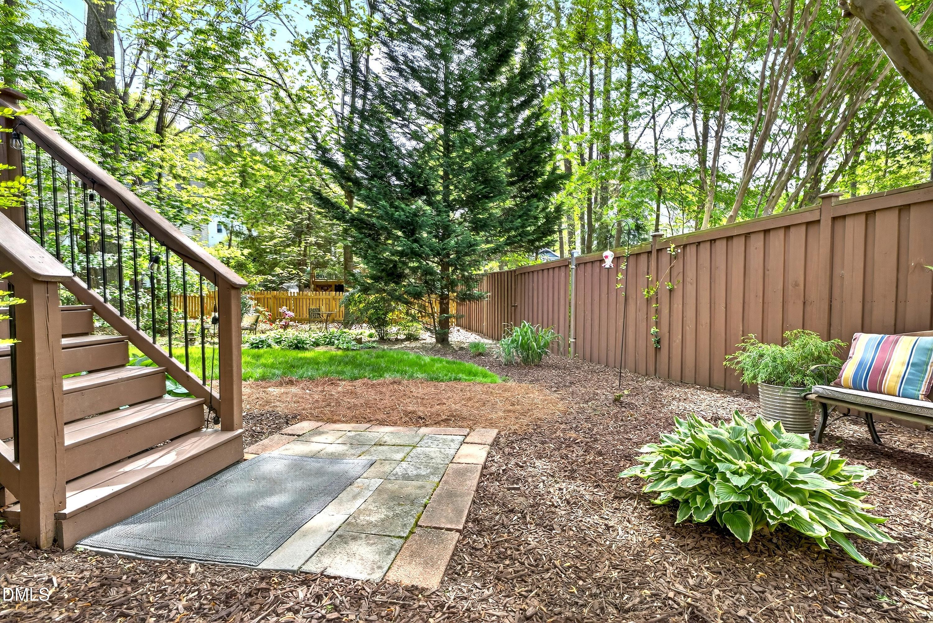 9432 Cartersville Court Raleigh, NC 27617 - Photo 42 of 66 a view of garden with wooden stairs