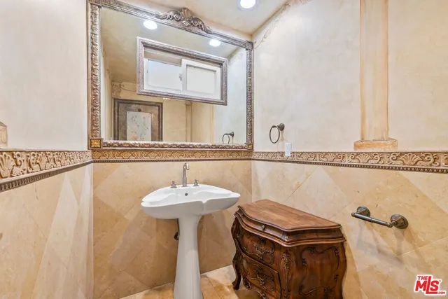 a bathroom with a sink a mirror and a bathtub
