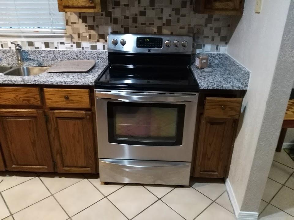 707 Valley Road Crestview, FL 32539 - Photo 8 of 14 a stove top oven sitting inside of a kitchen
