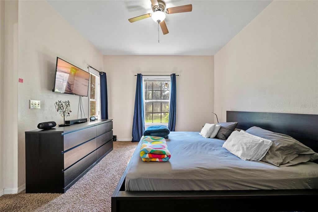 3701 Conroy Road, Unit 1812 Orlando, FL 32839 - Photo 16 of 37 a bedroom with a bed and window