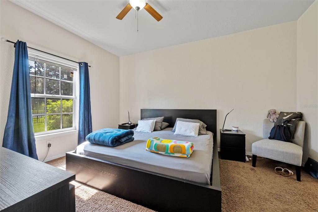 3701 Conroy Road, Unit 1812 Orlando, FL 32839 - Photo 17 of 37 a living room with furniture and a window