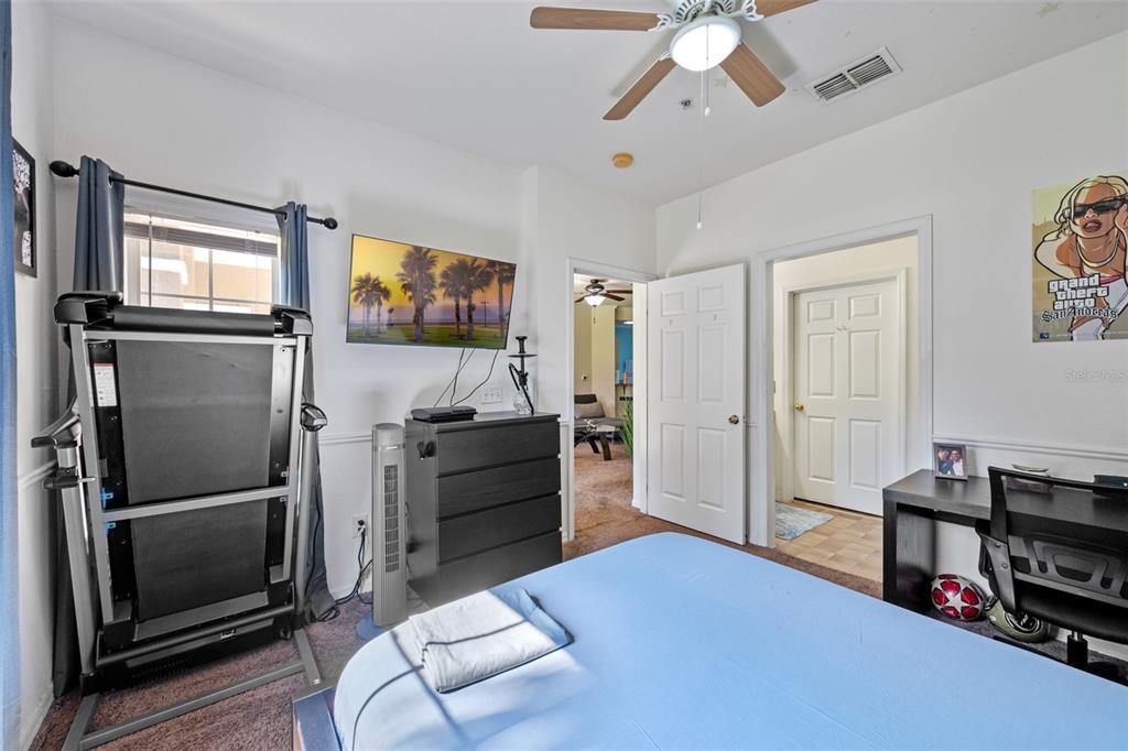 3701 Conroy Road, Unit 1812 Orlando, FL 32839 - Photo 22 of 37 a living room with furniture and a flat screen tv