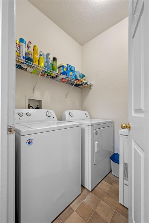 3701 Conroy Road, Unit 1812 Orlando, FL 32839 - Photo 25 of 37 a utility room with dryer and washer
