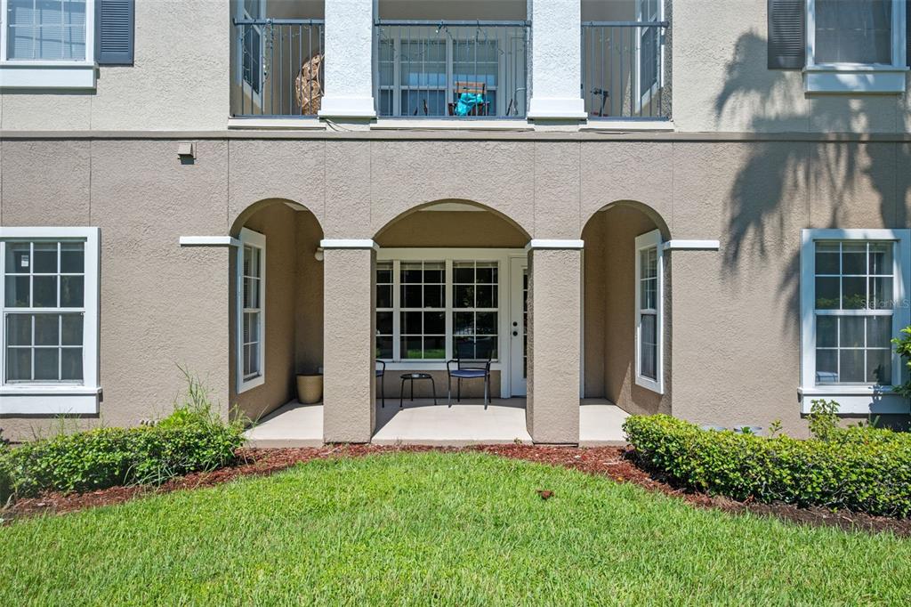 3701 Conroy Road, Unit 1812 Orlando, FL 32839 - Photo 26 of 37 a front view of a house with garden