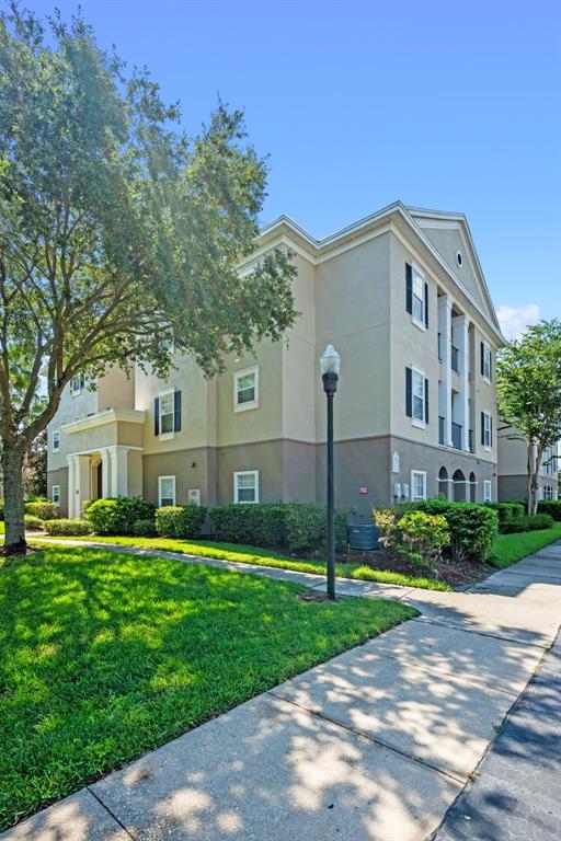 3701 Conroy Road, Unit 1812 Orlando, FL 32839 - Photo 29 of 37 a front view of house with yard and green space