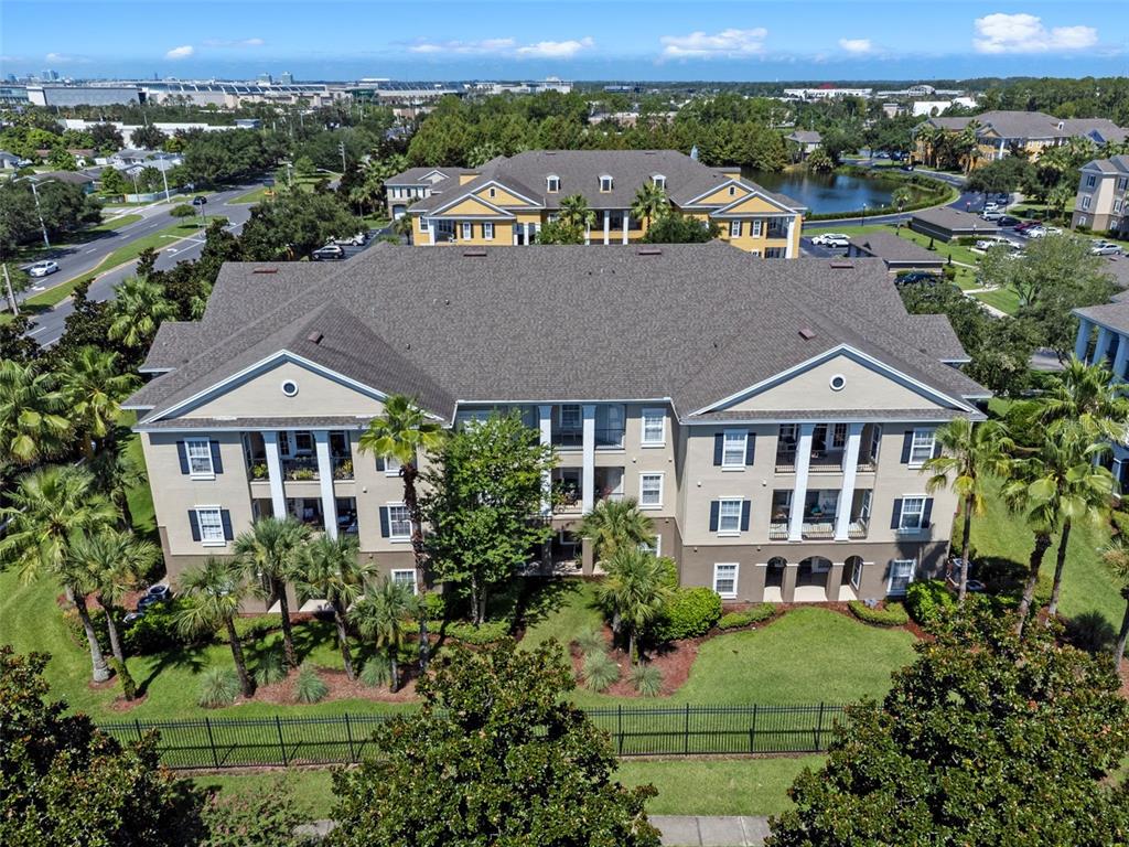 3701 Conroy Road, Unit 1812 Orlando, FL 32839 - Photo 30 of 37 an aerial view of a house with a garden