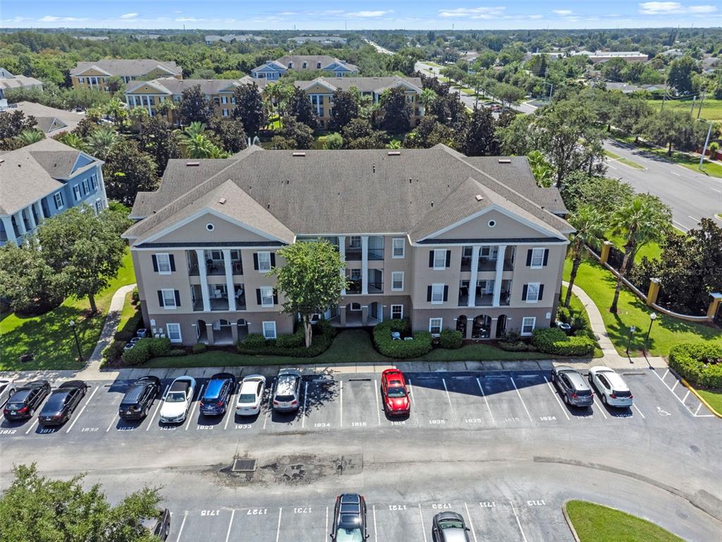 3701 Conroy Road, Unit 1812 Orlando, FL 32839 - Photo 32 of 37 an aerial view of a house with swimming pool and outdoor seating