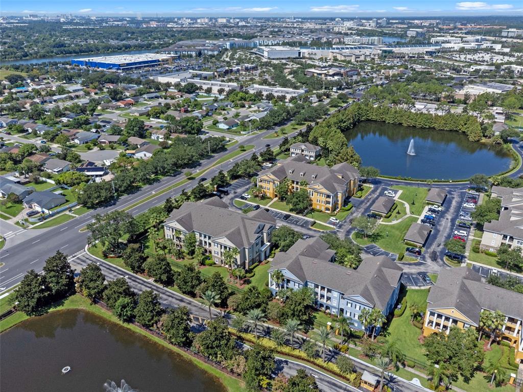 3701 Conroy Road, Unit 1812 Orlando, FL 32839 - Photo 35 of 37 an aerial view of a houses with a yard