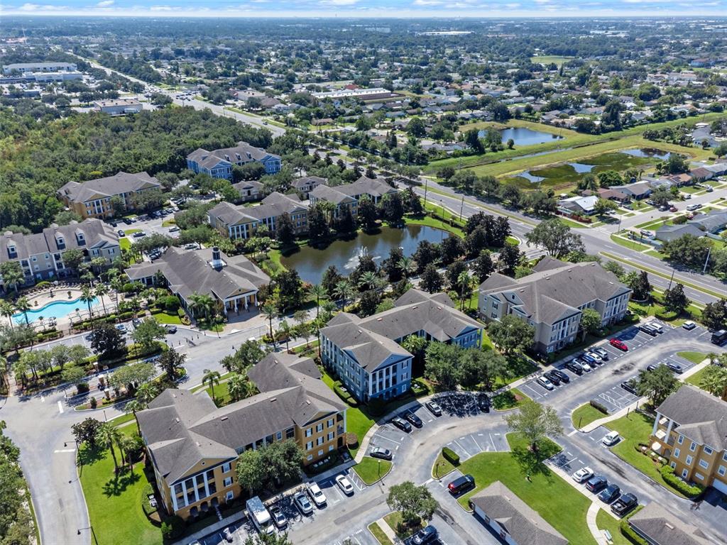 3701 Conroy Road, Unit 1812 Orlando, FL 32839 - Photo 36 of 37 an aerial view of a city with lots of residential buildings