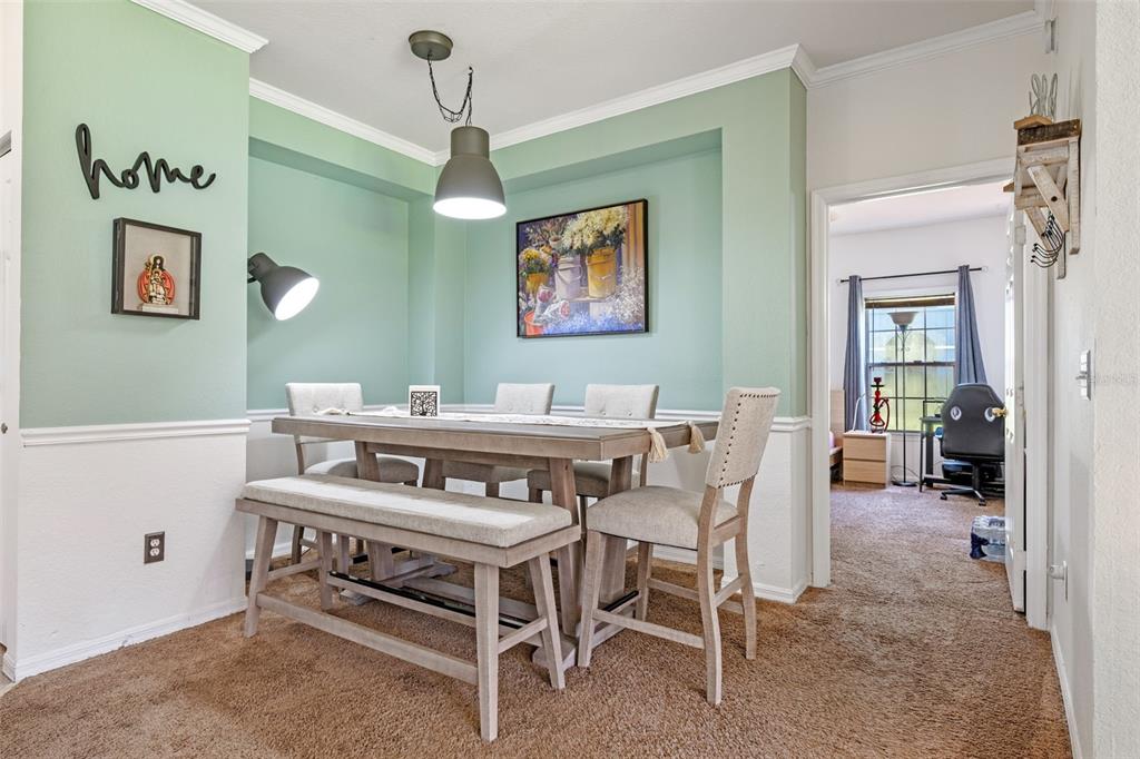 3701 Conroy Road, Unit 1812 Orlando, FL 32839 - Photo 10 of 37 a dining room with a furniture and window