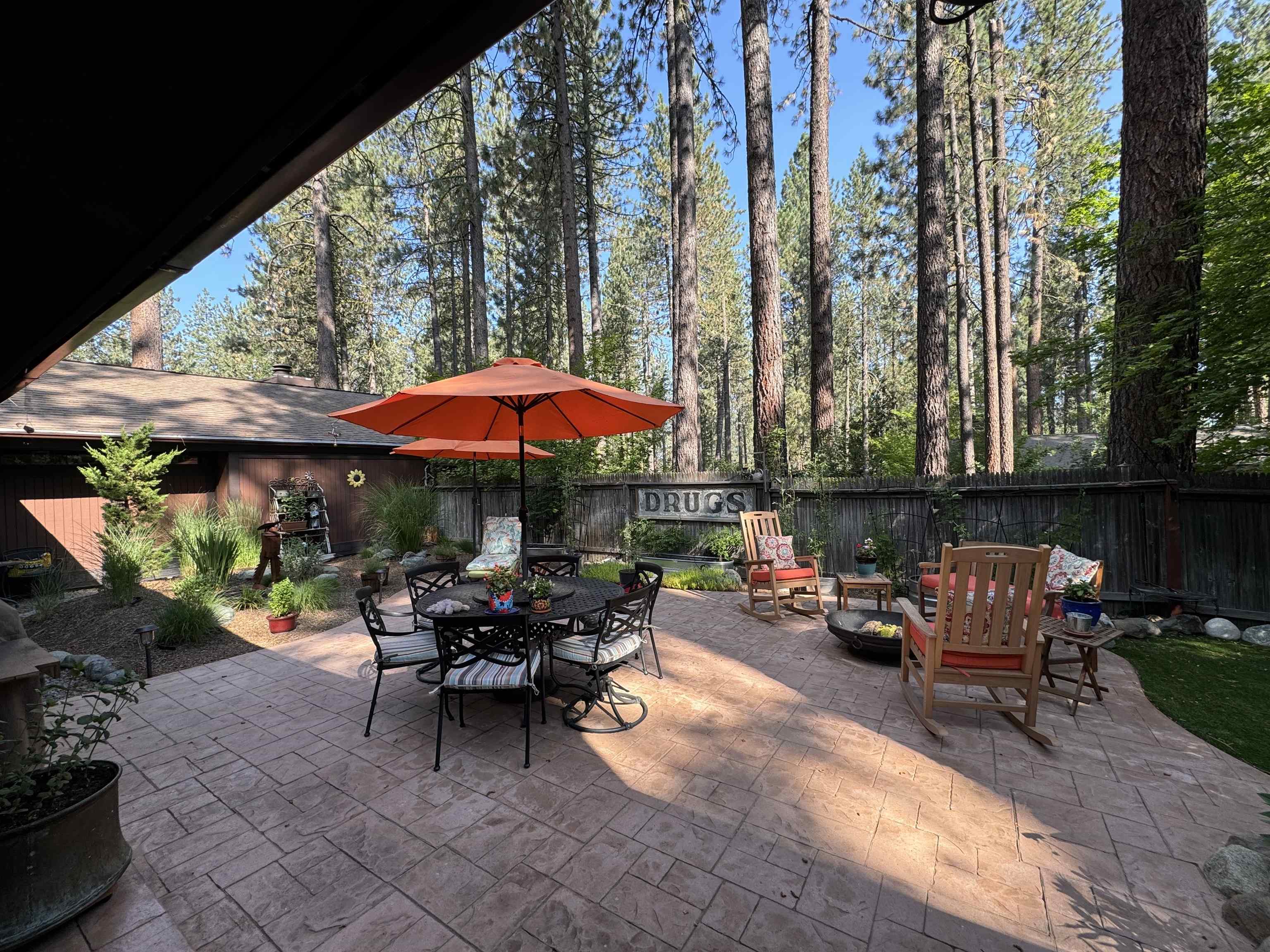 50 Graeagle Meadows Road Graeagle, CA 96103 - Photo 37 of 39 an outdoor space with patio lots of furniture and umbrella
