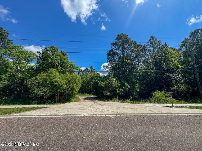 921 Cole Road Jacksonville, FL 32218 - Photo 1 of 21 a view of a yard and basketball court