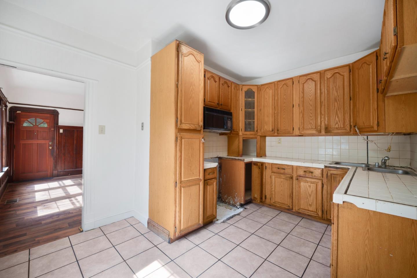 674 South 5th Street San Jose, CA 95112 - Photo 16 of 32 a kitchen with stainless steel appliances granite countertop a refrigerator and a stove top oven