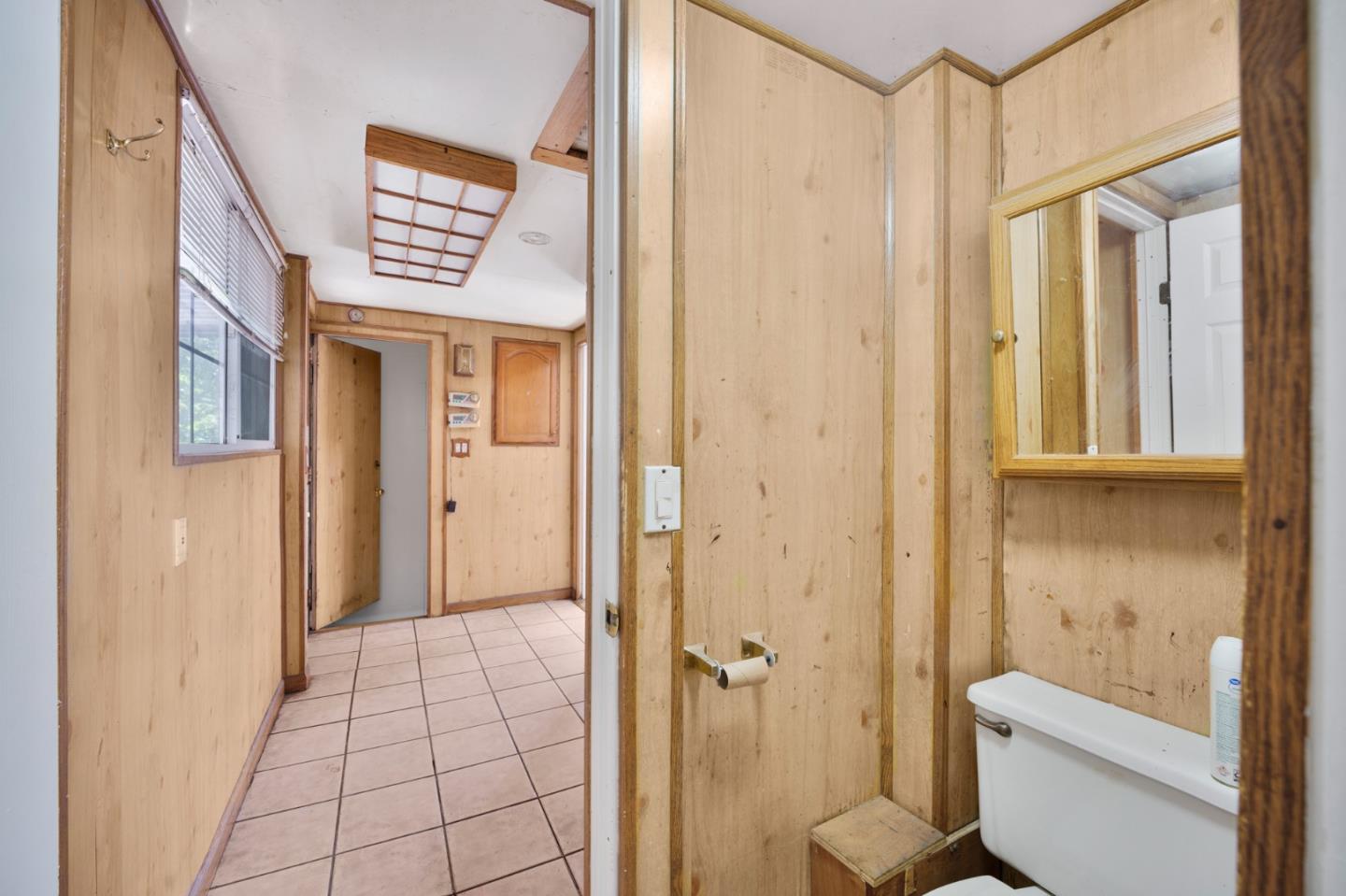 674 South 5th Street San Jose, CA 95112 - Photo 20 of 32 a bathroom with a toilet a sink and shower