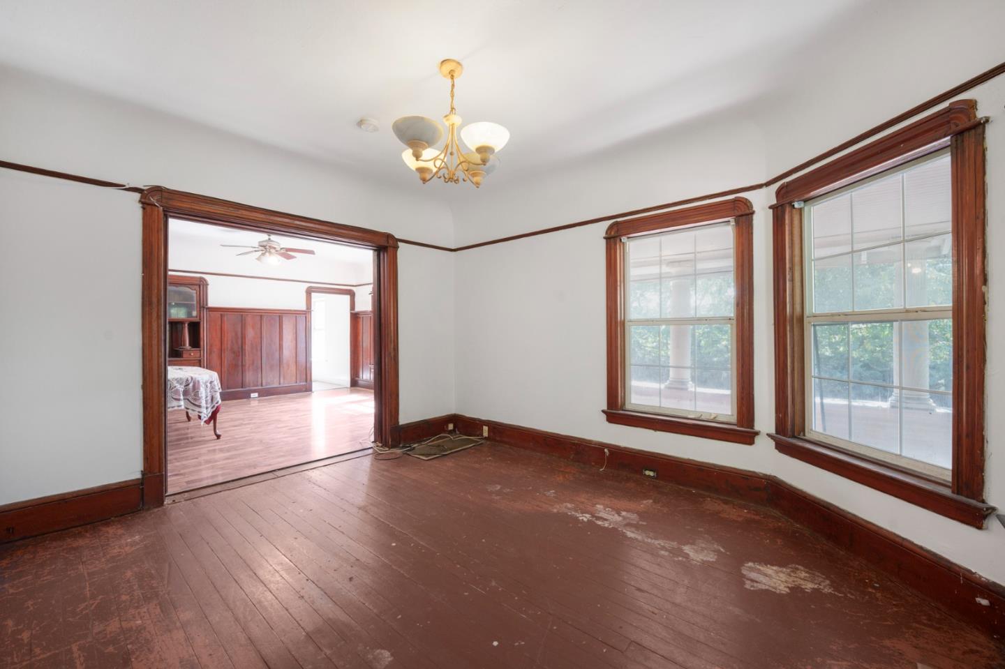 674 South 5th Street San Jose, CA 95112 - Photo 9 of 32 a view of an empty room with a window and wooden floor