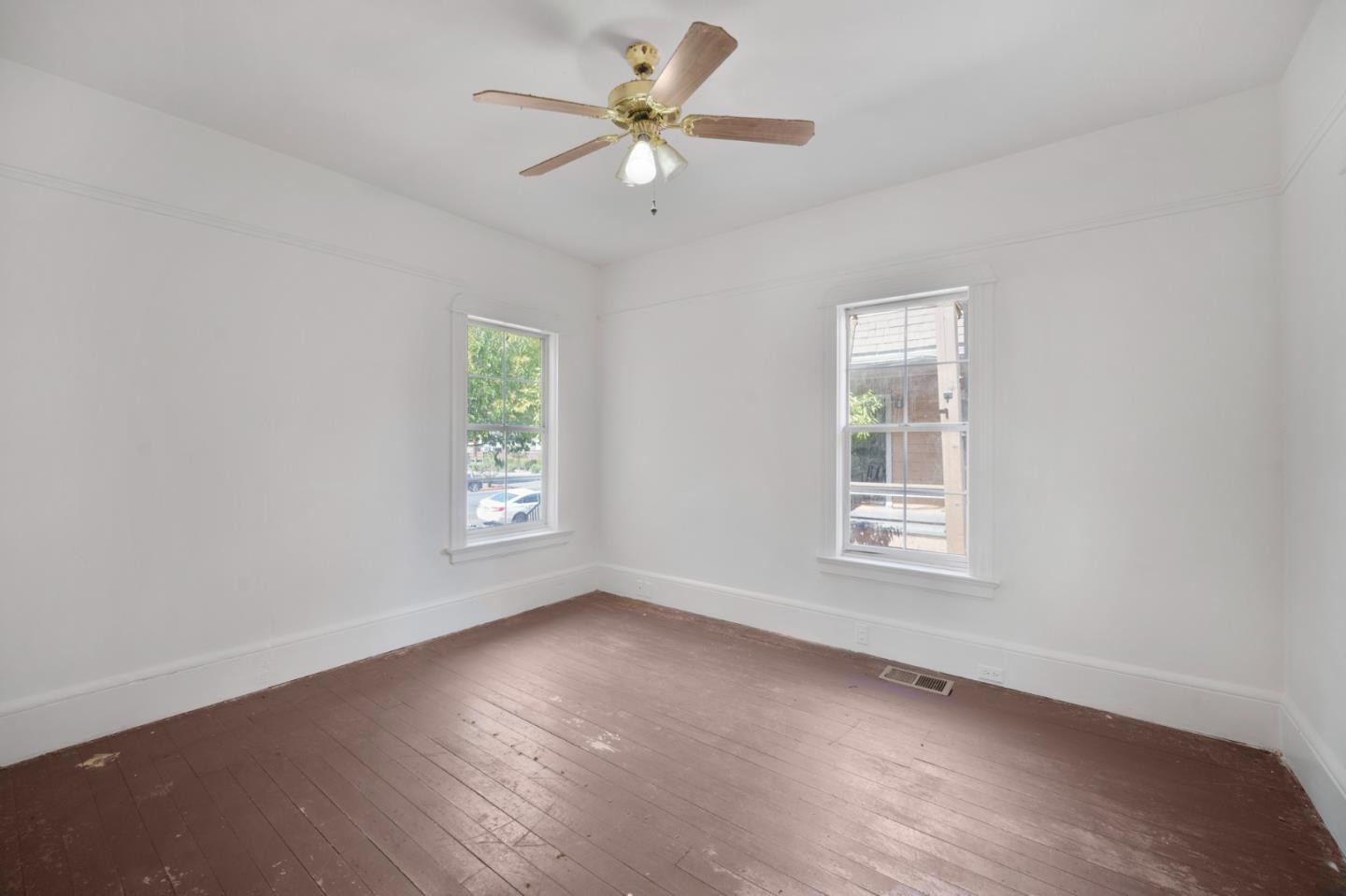 674 South 5th Street San Jose, CA 95112 - Photo 10 of 32 wooden floor in an empty room with a window