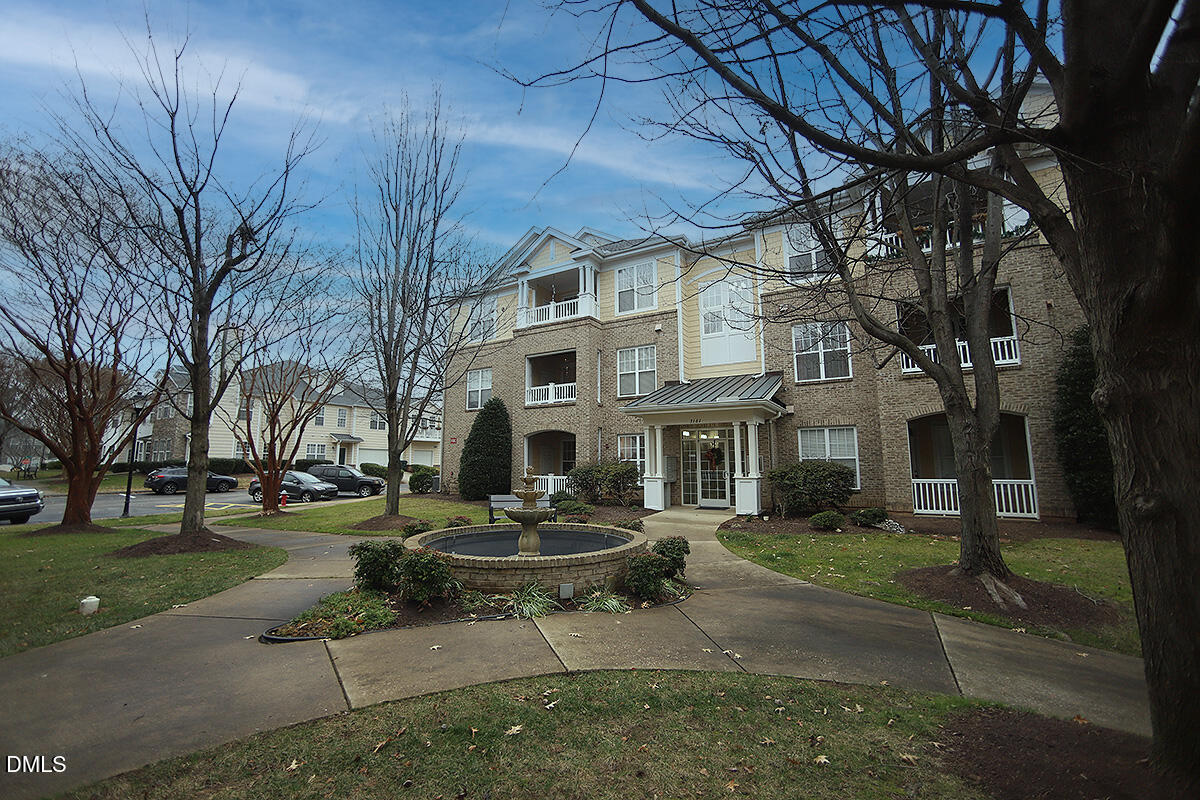 3161 Hemlock Forest Circle, Unit 101 Raleigh, NC 27612 - Photo 20 of 21 a building outdoor space with patio