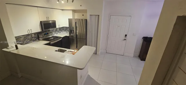 a utility room with shower and mirror