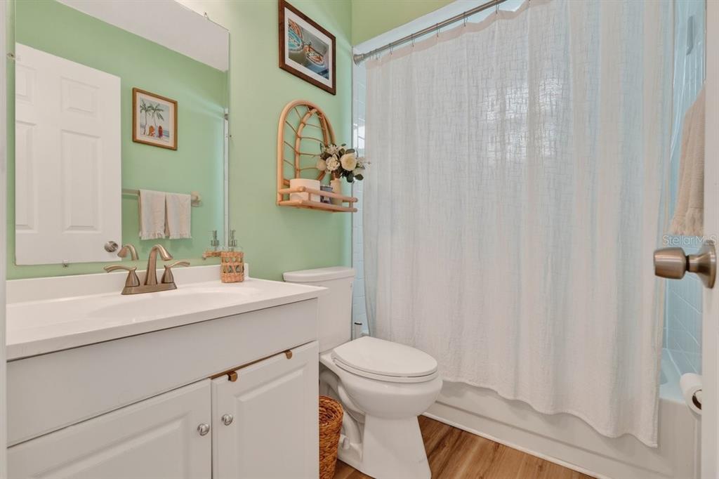 2012 Mango Tree Drive Edgewater, FL 32141 - Photo 13 of 36 a bathroom with a toilet a sink and a mirror