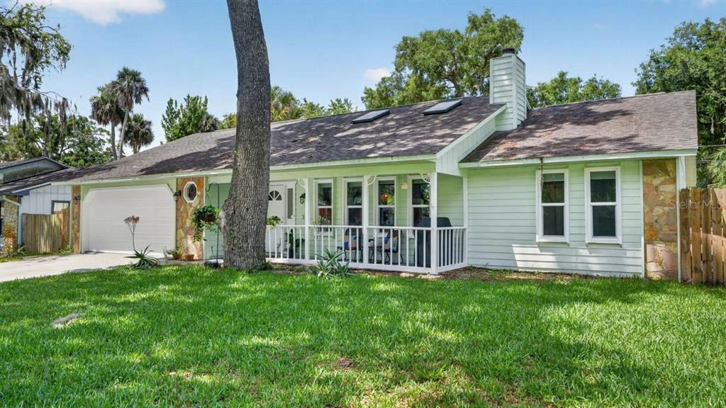 2012 Mango Tree Drive Edgewater, FL 32141 - Photo 2 of 36 a house view with a garden space