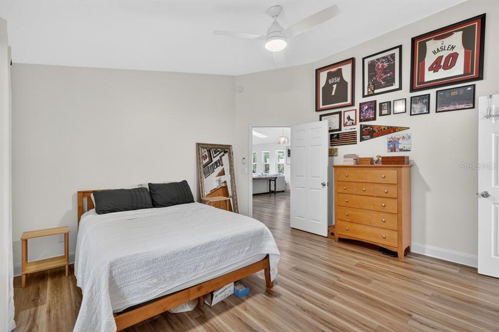 2012 Mango Tree Drive Edgewater, FL 32141 - Photo 21 of 36 a bedroom with a bed and dresser