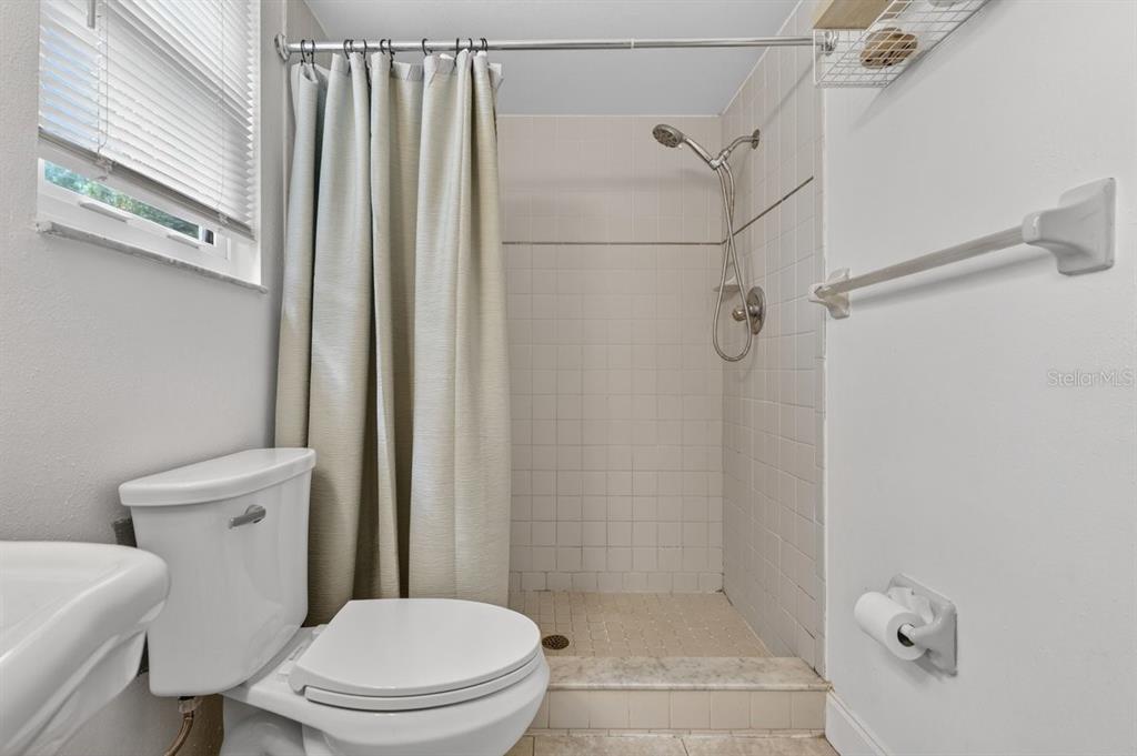 2012 Mango Tree Drive Edgewater, FL 32141 - Photo 23 of 36 a white toilet sitting next to a bathroom sink
