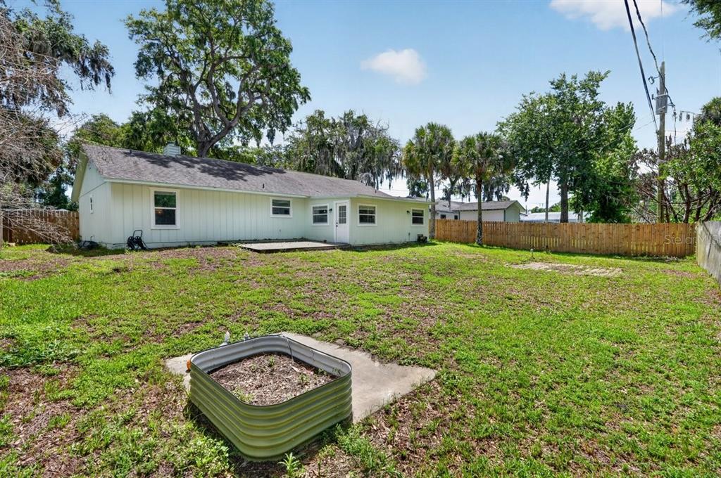 2012 Mango Tree Drive Edgewater, FL 32141 - Photo 29 of 36 a view of a house with a yard and sitting area