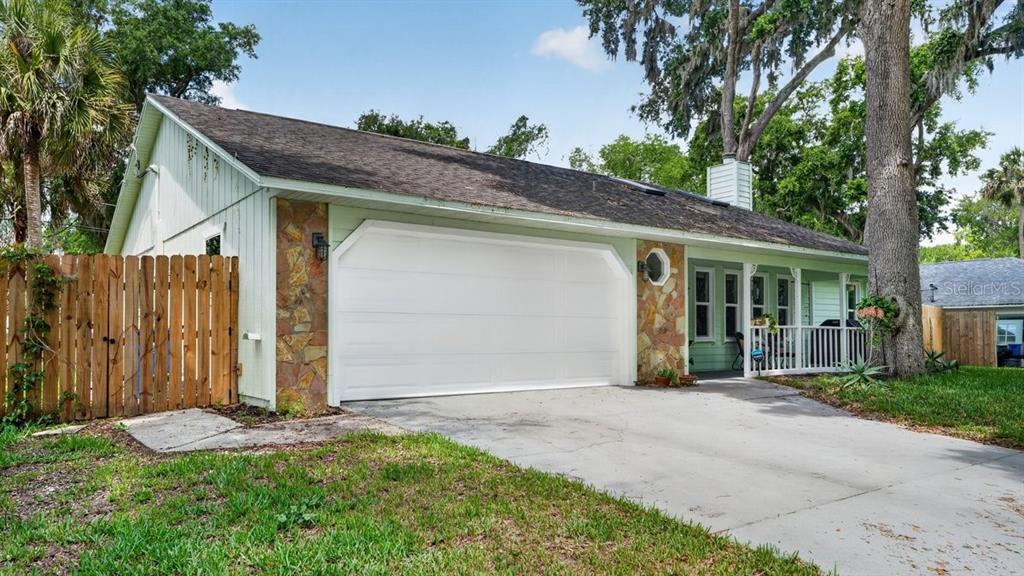 2012 Mango Tree Drive Edgewater, FL 32141 - Photo 3 of 36 a front view of a house with garden