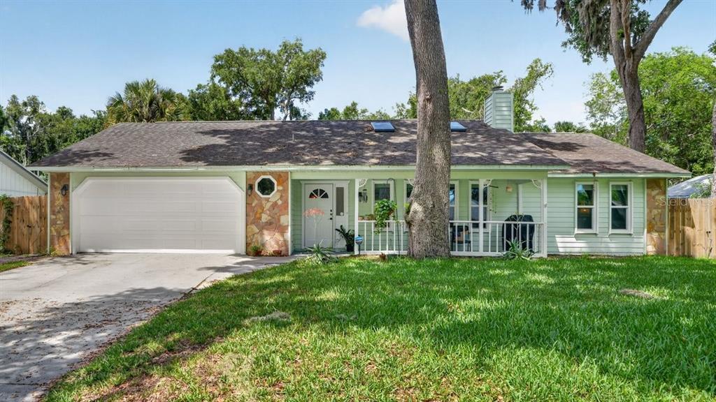 2012 Mango Tree Drive Edgewater, FL 32141 - Photo 36 of 36 a front view of a house with a yard table and chairs
