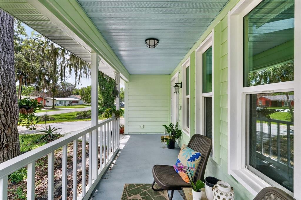 2012 Mango Tree Drive Edgewater, FL 32141 - Photo 5 of 36 a balcony with wooden floor and outdoor seating