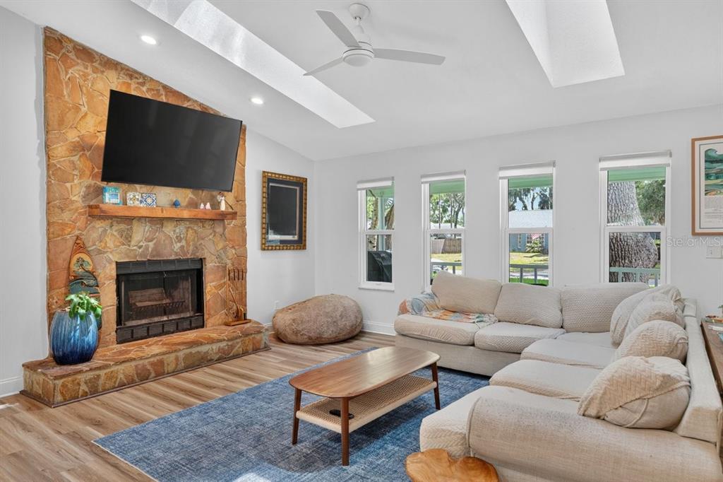 2012 Mango Tree Drive Edgewater, FL 32141 - Photo 8 of 36 a living room with furniture a fireplace and a flat screen tv