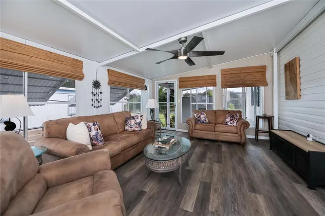 a kitchen with center island white cabinets and stainless steel appliances