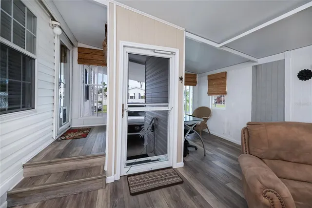 a kitchen with stainless steel appliances a refrigerator sink and microwave