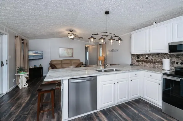 a living room with furniture and a rug
