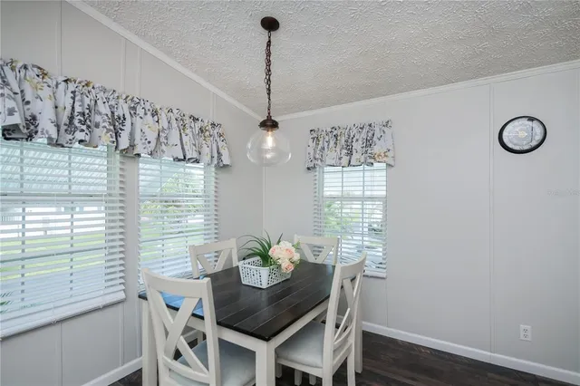 a bathroom with a granite countertop shower a sink and a mirror