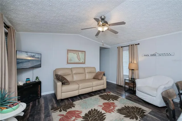 a bathroom with shower granite countertop a sink and a mirror